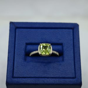 Peridot Yellow (1.7 ctw) Set in 14kt Yellow Gold Ring with Diamonds (0.07 ctw)