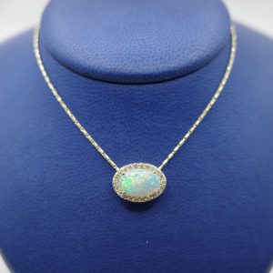 Opal (1.36 ct) Pendant Set in 14kt Yellow Gold with Diamond (0.22 ctw) Halo
